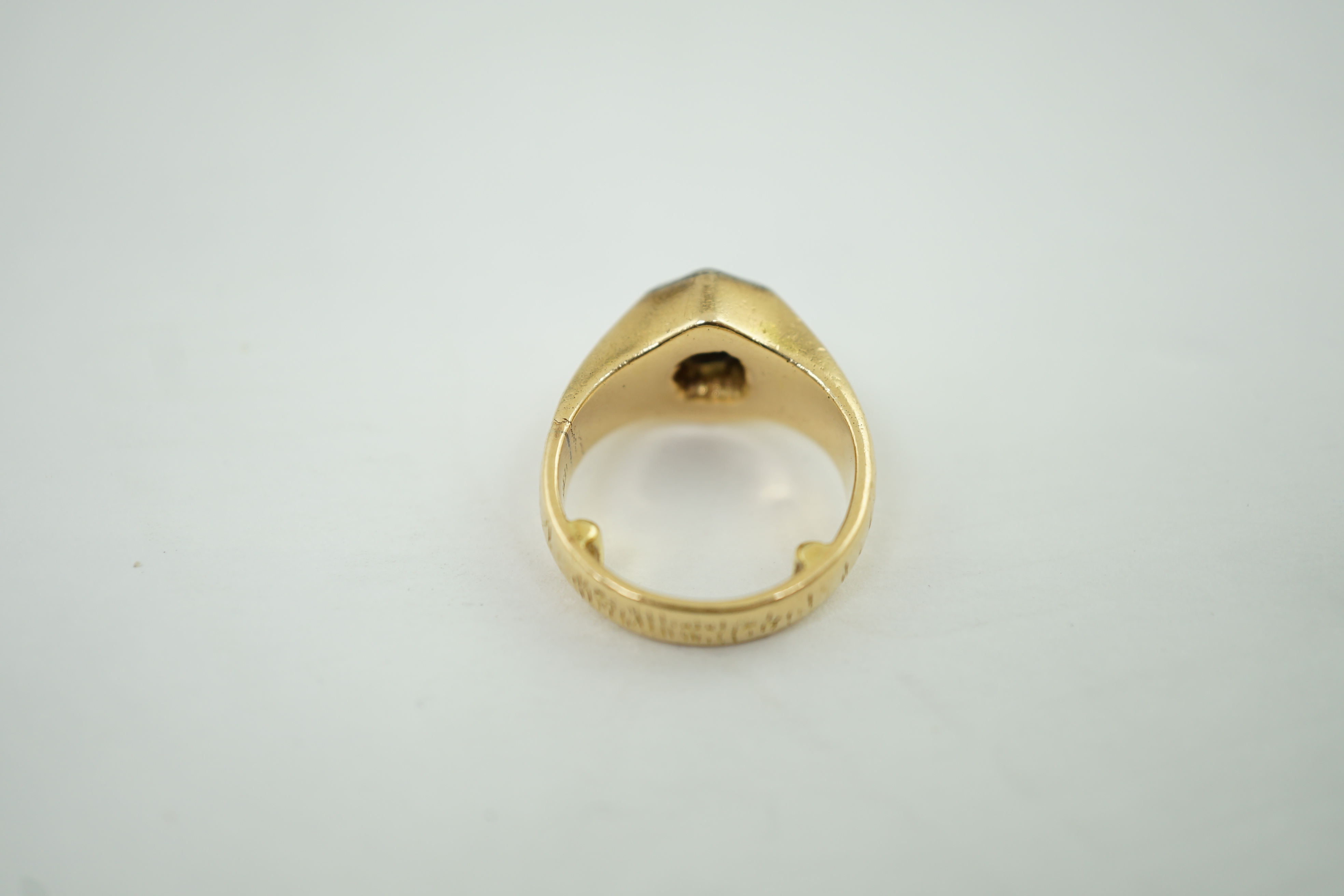 A textured 18ct gold and solitaire diamond set ring